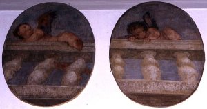 Two winged putti climbing over a balustrade, roundels from the sacristy